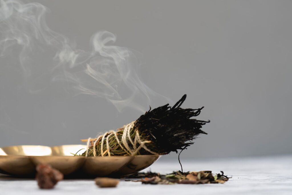 Smoking herb bundle and crystals for safe crystal cleansing.