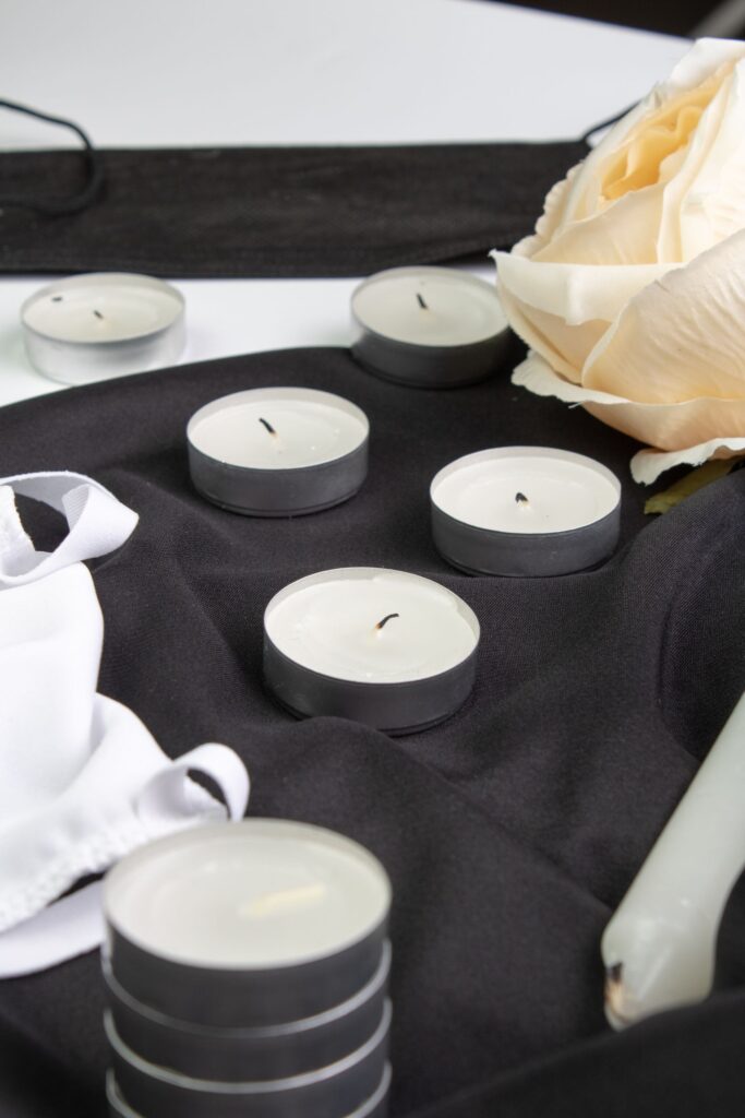 Candles on black fabric for beginner protection magic.