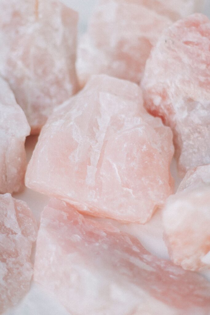 Raw rose quartz crystals for love and compassion magic.