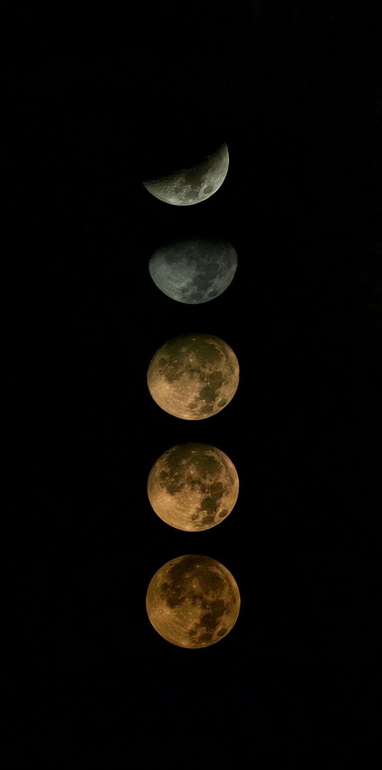 Progression of moon phases against a dark sky.